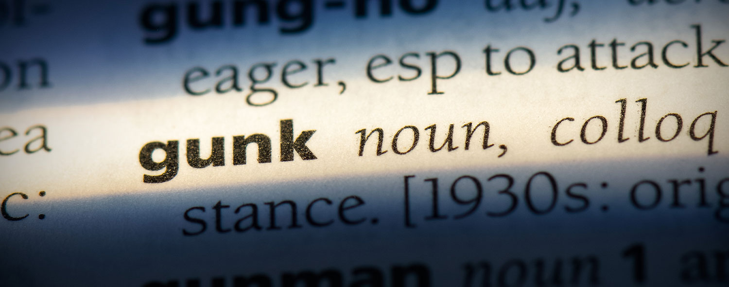 Dictionary listing for the word "gunk" which describes the messy nature of cosmoline